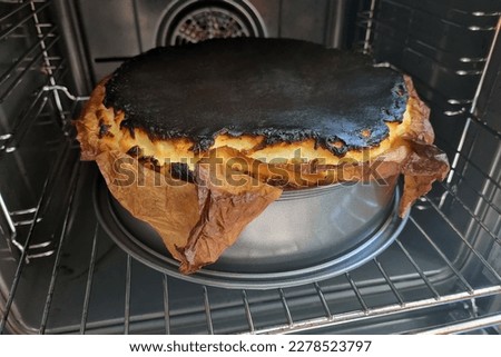 Burnt pie crust during home cooking. Burnt food Royalty-Free Stock Photo #2278523797