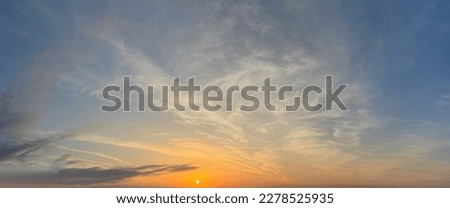 Natural background concept. Sunset gold sun, blue sky and white clouds background