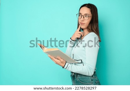 Photo of smiling shiny toothy clever lady reading book wear casual outfit isolated green color background