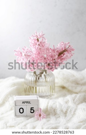 Pink hyacinth in vase and calendar date April 5. Included in the group of horizontal and vertical photos with all April dates