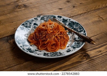 Spaghetti all'Assassina style pasta and parmesan cheese