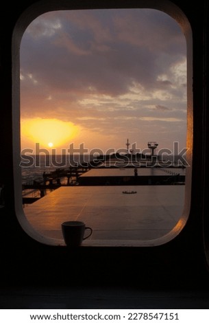 Morning cup of tea with a stunning sky from a merchant ship carrying bulk cargo underway at sea Royalty-Free Stock Photo #2278547151