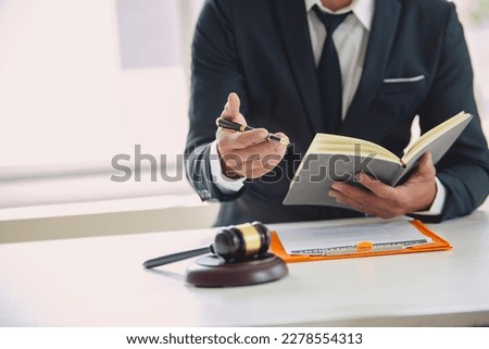 The lawyer considers with contract documents and laptops in the trial room. Justice, law, lawyer and judicial judge Royalty-Free Stock Photo #2278554313