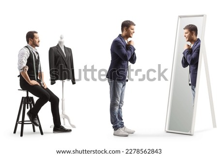 Male customer trying on a suit in front of a mirror at a tailors workshop isolated on white background Royalty-Free Stock Photo #2278562843