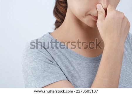 A foul smell when breathing may be caused by. 1. Infections in the nasal cavity such as colds, flu, sinusitis. Royalty-Free Stock Photo #2278583137