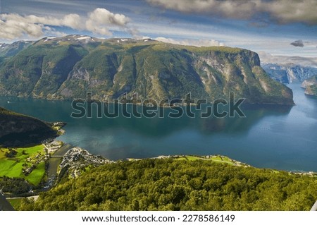 panoramic view from above of the sognefiord or fiord of the dreams and the village of Aurland in summer Royalty-Free Stock Photo #2278586149