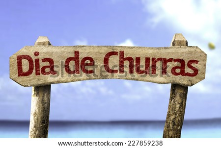 Barbecue Day (In Portuguese) wooden sign with a beach on background