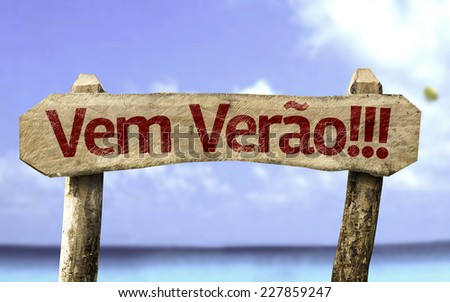 Summer Coming!!! (In Portuguese) wooden sign with a beach on background