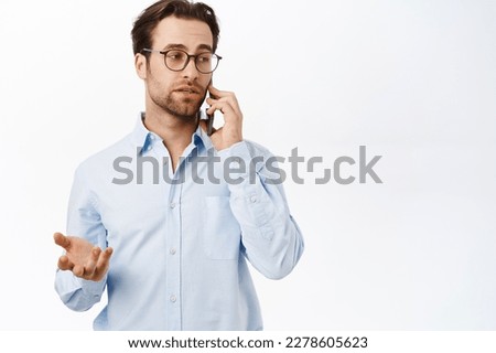 Businessman talking on mobile phone. Male entrepreneur calling someone, having a business call, standing over white background. Royalty-Free Stock Photo #2278605623