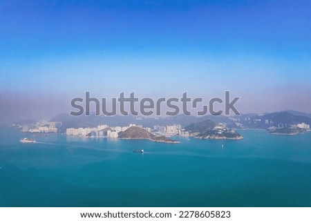 Cargo container ship sailing across the ocean, south of the Hong Kong area, daytiime