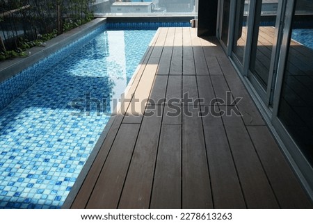 exotic wooden terrace and small pool  Royalty-Free Stock Photo #2278613263