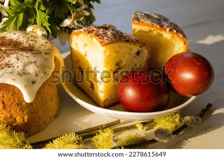 Easter cake. Painted easter eggs and sweet bread in a sun shine, orthodox easter. Traditional food, religious. Home made bakery. Royalty-Free Stock Photo #2278615649