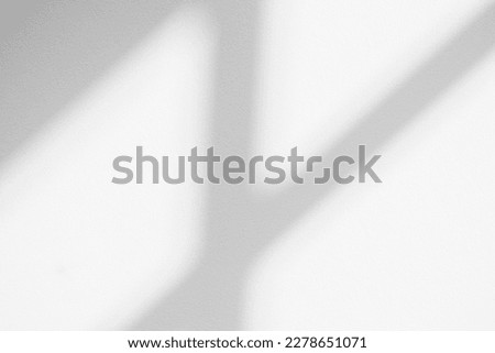 Gray shadow and light blur abstract background on white wall  from window.  Dark grey shadows indoor in room  background, monochrome, shadow overlay effect for backdrop and mockup design

