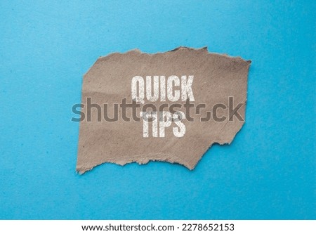 Quick Tips written on ripped paper. Tips and Tricks concept background.