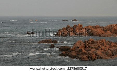 Dawn in the portuguese coast with interesting red rocks