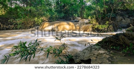 Nature landscape of flash flood in waterfall by previous heavy rain in Thailand