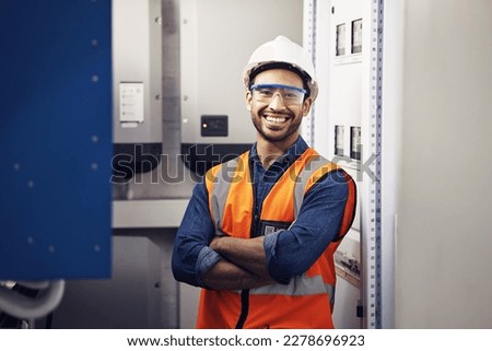 Portrait, happy man and engineering technician in control room, inspection service or industry maintenance. Electrician, arms crossed and smile in electrical substation, system or industrial mechanic Royalty-Free Stock Photo #2278696923