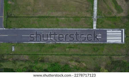 BONE, INDONESIA - JULY 07 th, 2021 - airport runway view Royalty-Free Stock Photo #2278717123
