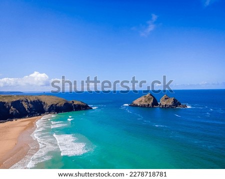 The aerial view of Holywell beach, a huge beach of golden sand backed by grass tufted dunes in Cornwall Royalty-Free Stock Photo #2278718781