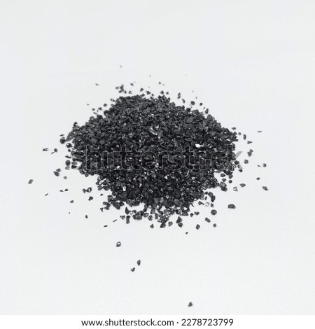 Anthracite commonly used in the water filtration to remove impurities and improve water quality. Anthracite known as hard black coal is acompact variety of coal. Isolated on white background