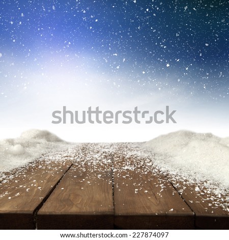 sky of blue desk of wood snow and free space 