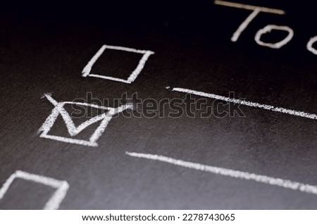 check list with mark on the chalkboard