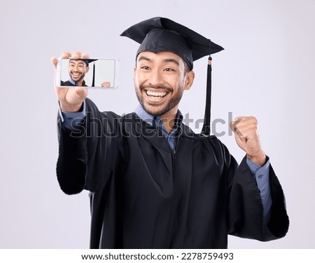 Asian man, selfie and smile for graduation, scholarship or diploma against a white studio background. Happy male graduate smiling for profile picture, vlog or photo in memory of milestone achievement