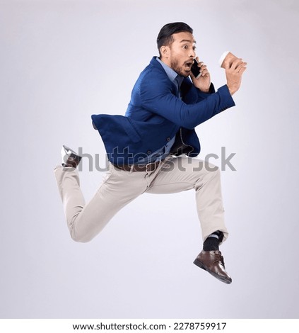 Phone call, rush and late with a business man on white background in studio running to an appointment. Conversation, coffee and hurry with a male employee sprinting fast to keep a schedule Royalty-Free Stock Photo #2278759917