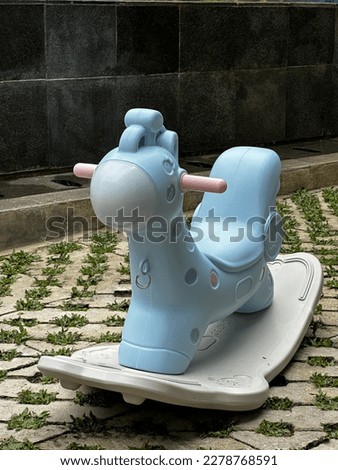 light blue children's toy horse