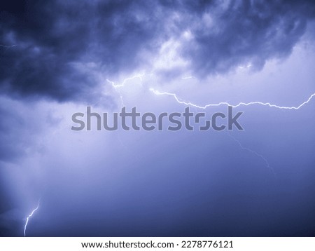 A bright lightning strike during the rain created a beautiful picture
