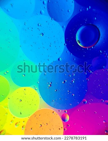 Abstract photography of oil drops on water 