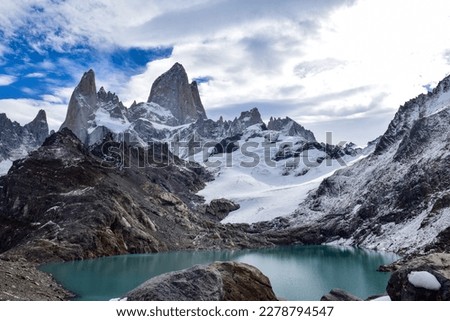 this picture was capture hiking up this beautiful Fitz Roy mountain view with the snow all over the landscape in the background and also the oasis natural ice lake at the bottom of the mountain.