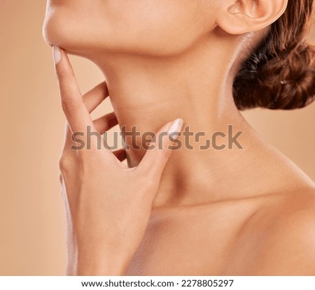 Skincare, beauty and neck of a woman with a glow isolated on a brown background in a studio. Wellness, health and a girl feeling and touching skin for satisfaction, grooming and care for anti aging Royalty-Free Stock Photo #2278805297