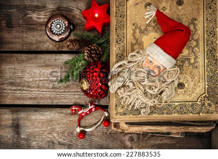 vintage christmas decoration with antique baubles and toys on wooden background. sentimental nostalgic retro style picture. dark designed, selective focus
