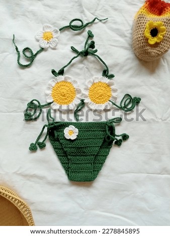 Crochet bikini daisy flowers handmade background texture 