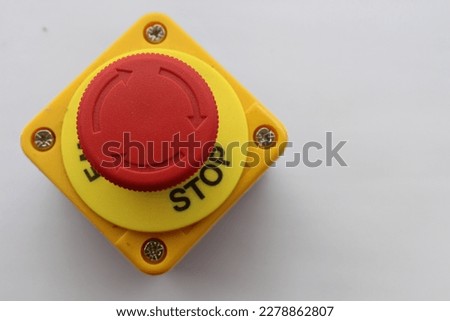Big Red emergency button or stop button for manual pressing. STOP button for industrial equipment, emergency stop. For factory and industrial facility