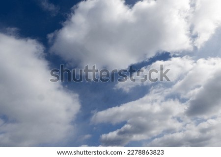 Blue sky with heavy white clouds, ideal for sky replacement in editing programs