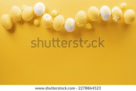 Happy easter! Colourful Easter eggs on yellow background. Decoration concept for greetings and presents on Easter Day celebrate time.