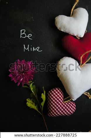 Hearts on the blackboard and note with chalk