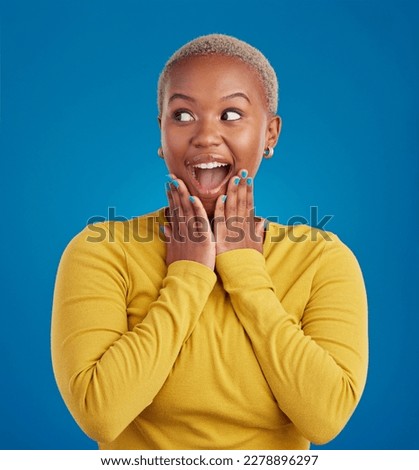 Black woman, happy and surprise face in studio for fashion, youth or notification by blue background. Young african girl, model or happiness with excited wow, announcement or deal with hands by mouth