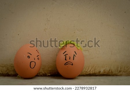 two eggs, angry egg expression and crying egg expression