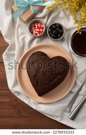 Top view of heart shaped cake.  Top view of heart shape chocolate cake. Valentine's day, mothers day, birthday, celebration concept. copy space, space for text.