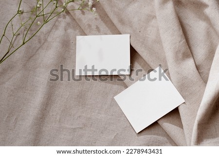 Two blank parer cards with mockup copy space on a neutral linen beige background, aesthetic spring summer business brand template