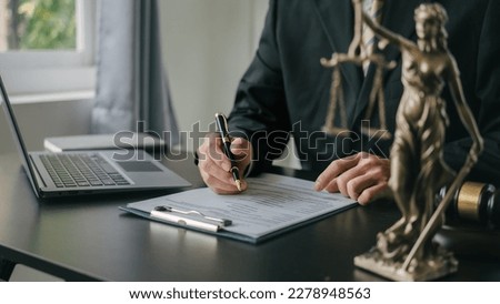 Reading a contract, Lawyers and legal requirements and bribery in adjudicating and adjudicating litigation cases. Royalty-Free Stock Photo #2278948563