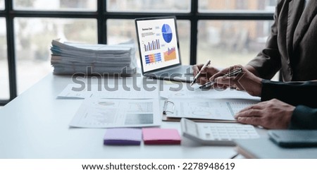 Auditor and the company's bookkeeper jointly review the balance sheet and assets, liabilities and equity information in the quarterly report, bookkeeping concept. Royalty-Free Stock Photo #2278948619