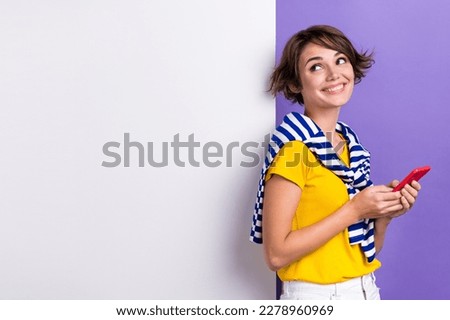 Photo of cheerful pretty lady wear trendy tied striped pullover special seasonal offer empty space isolated on purple color background
