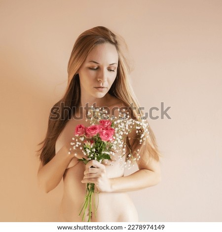 Young woman with bouquet of flowers.