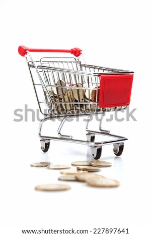 coins in shopping cart on the white background