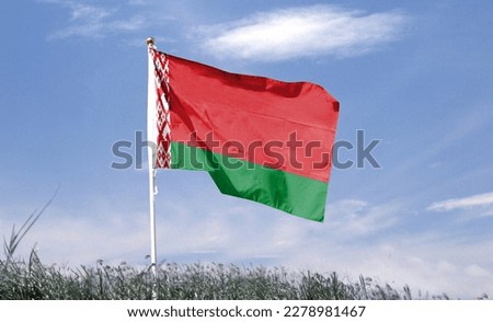 Belarus flag on cloudy sky. waving in the sky Royalty-Free Stock Photo #2278981467