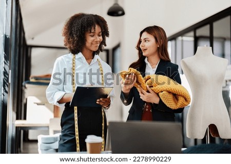 Multi ethnic young teen african american and asian woman fashion designer stylish and friend working at fashion Business studio